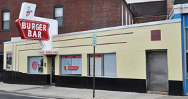 burger bar 1942 opened snack featuring running king sign
